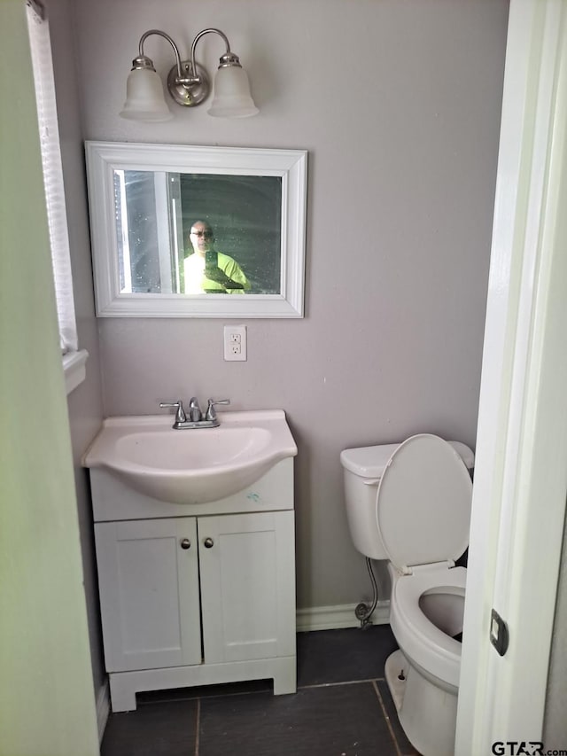 3107 Hamilton Ln, Texarkana, TX 75501 - bathroom featuring vanity, tile patterned flooring, toilet, and baseboards