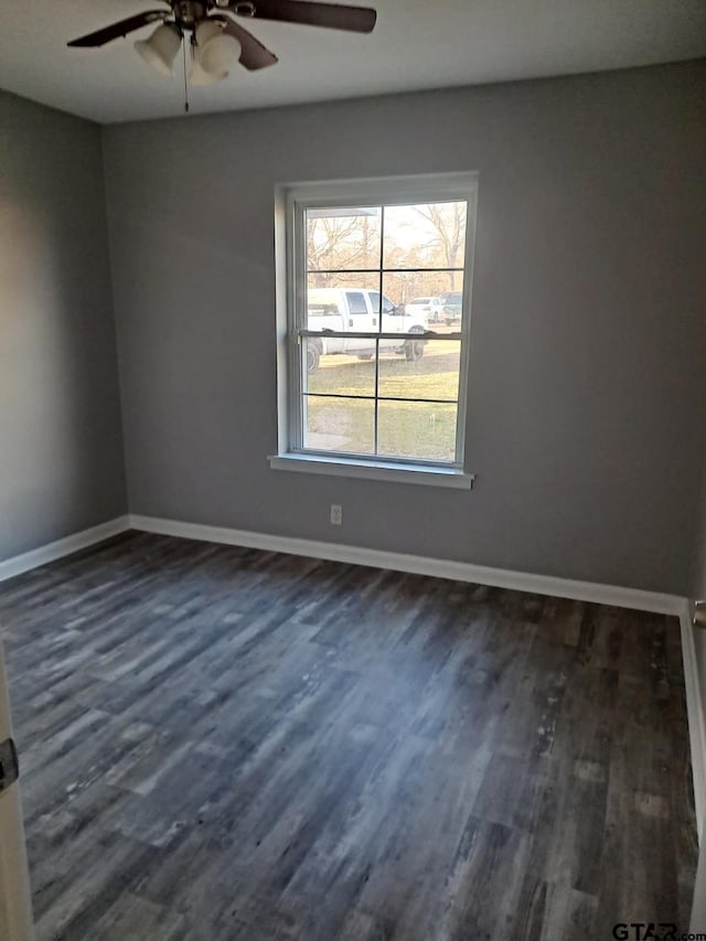 3107 Hamilton Ln, Texarkana, TX 75501 - unfurnished room with a ceiling fan, dark wood finished floors, and baseboards