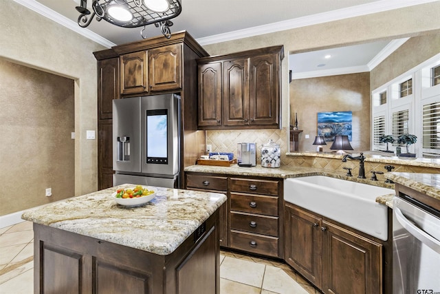 11187 Hunters Trl, Flint, TX 75762 - kitchen with appliances with stainless steel finishes, light tile patterned floors, light stone countertops, and ornamental molding