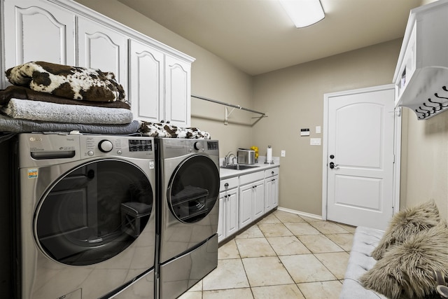 11187 Hunters Trl, Flint, TX 75762 - laundry room featuring washer and dryer, cabinet space, and light tile patterned floors
