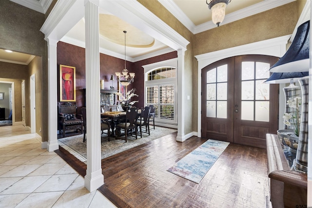 11187 Hunters Trl, Flint, TX 75762 - foyer entrance featuring french doors, ornate columns, a chandelier, and ornamental molding