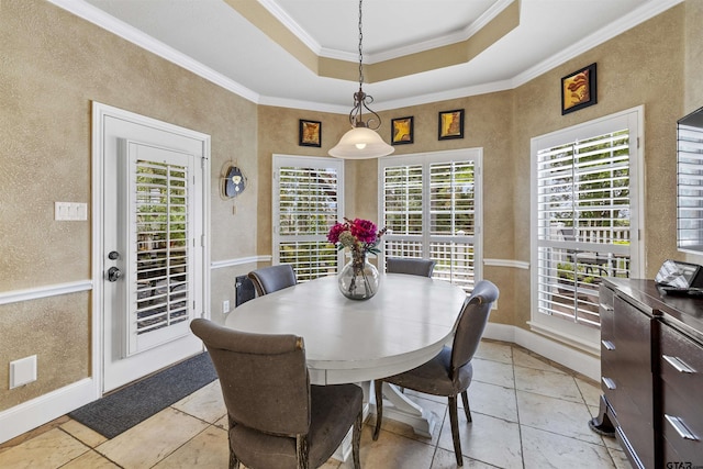 11187 Hunters Trl, Flint, TX 75762 - dining room with a textured wall, a tray ceiling, and ornamental molding