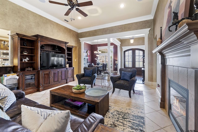 11187 Hunters Trl, Flint, TX 75762 - living room with a tiled fireplace, a ceiling fan, crown molding, light tile patterned floors, and recessed lighting