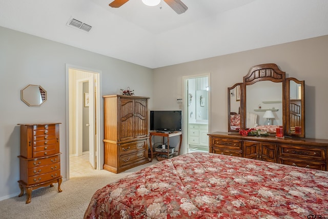 bedroom featuring ensuite bath, ceiling fan, and light carpet