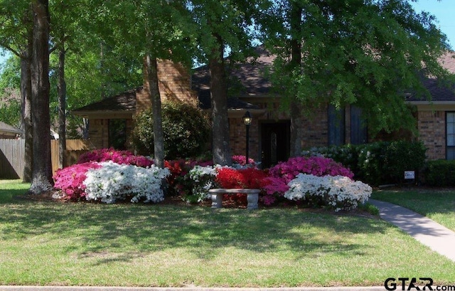 view of front of home with a front yard