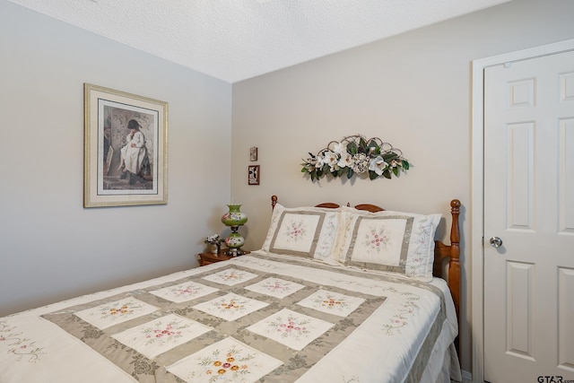 bedroom featuring a textured ceiling