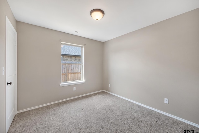 unfurnished room featuring carpet