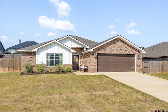 view of front of property with a front lawn and a garage