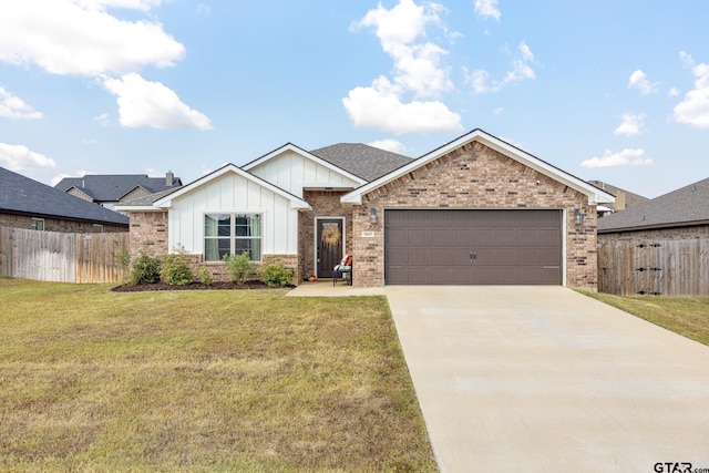 view of front of home with a garage and a front lawn