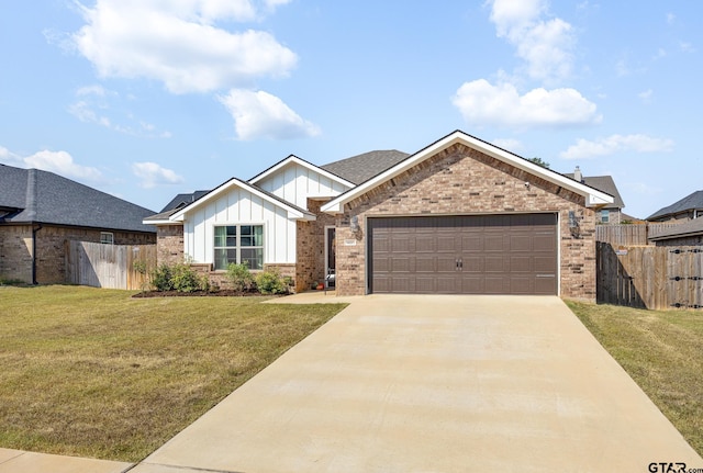 view of front of house with a garage and a front yard