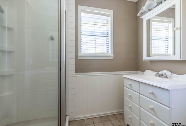 310 Windridge Rd, Palestine, TX 75801 - full bath with vanity, a shower stall, a wainscoted wall, and tile patterned flooring
