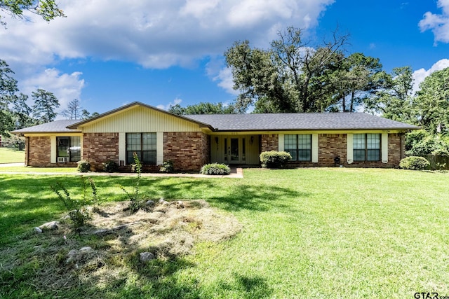 310 Windridge Rd, Palestine, TX 75801 - single story home featuring a front lawn, french doors, and brick siding