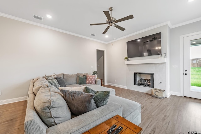 137 Sides Blvd, Bullard, TX 75757 - living area with ceiling fan, wood finished floors, a fireplace, ornamental molding, and baseboards