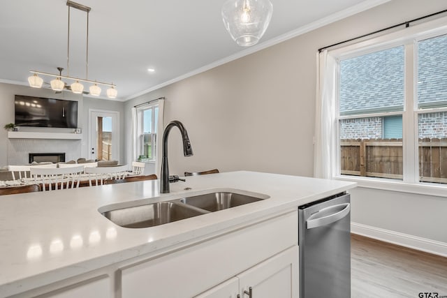 137 Sides Blvd, Bullard, TX 75757 - kitchen with stainless steel dishwasher, a sink, ornamental molding, hanging light fixtures, and white cabinetry