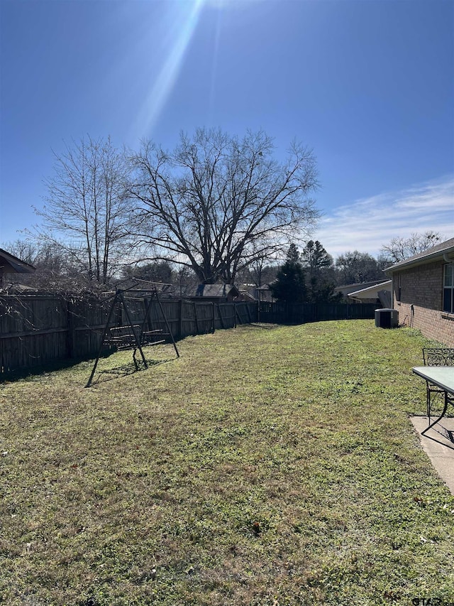 view of yard with cooling unit and a playground