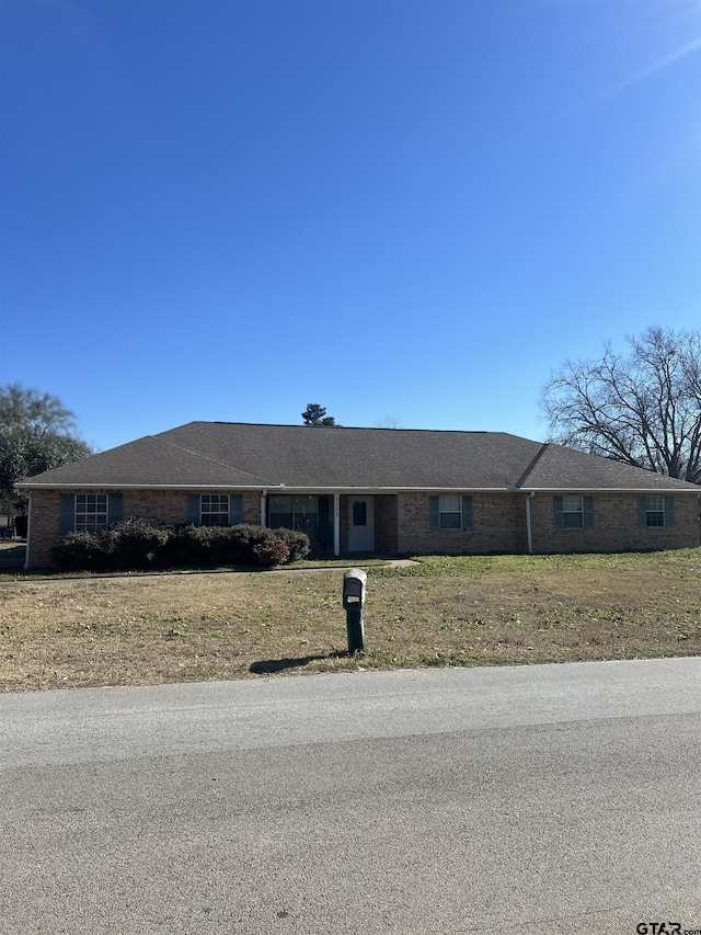 ranch-style house with a front yard