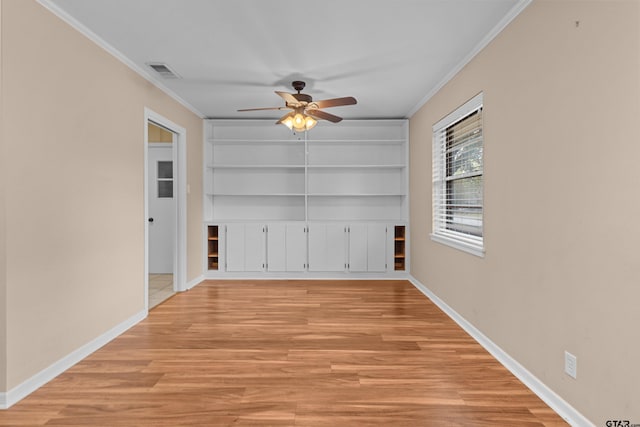 unfurnished room with light wood-type flooring, ceiling fan, and crown molding