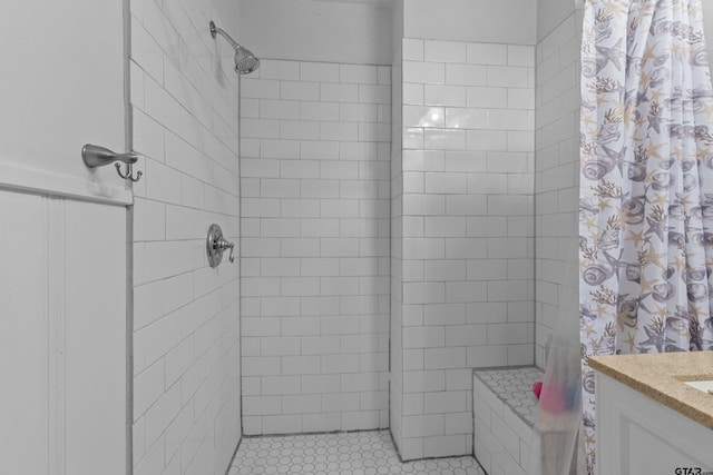 bathroom featuring vanity, walk in shower, and tile patterned floors