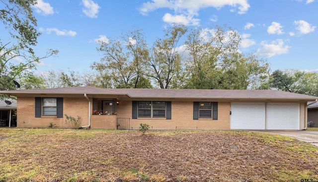 ranch-style house featuring a garage