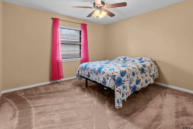 bedroom featuring ceiling fan and carpet