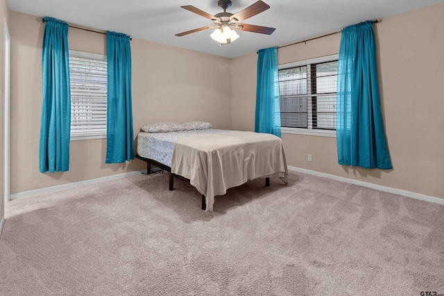 bedroom featuring ceiling fan and carpet floors