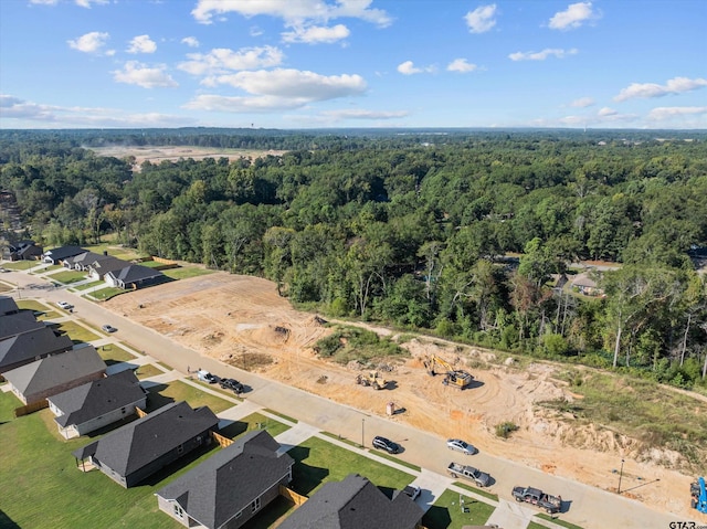 bird's eye view featuring a wooded view