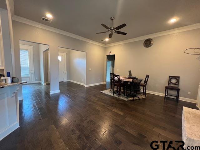 dining area with ceiling fan, dark hardwood / wood-style flooring, and ornamental molding