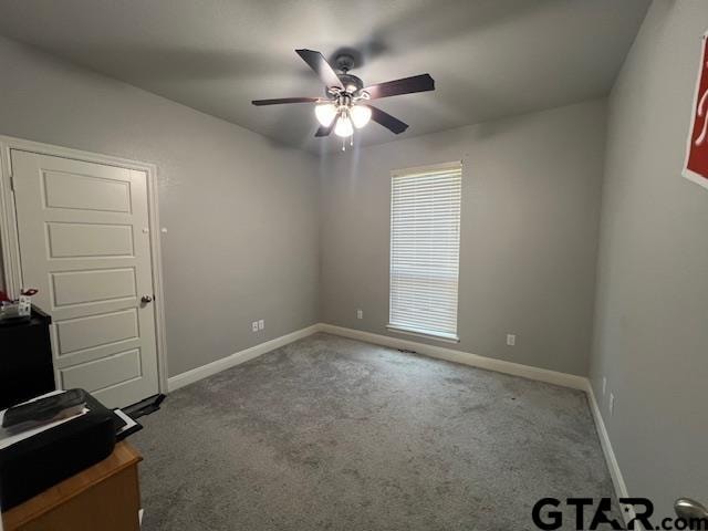 carpeted empty room with ceiling fan