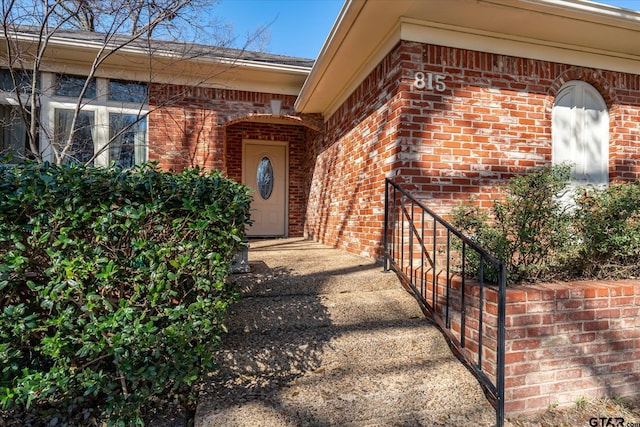 property entrance with brick siding