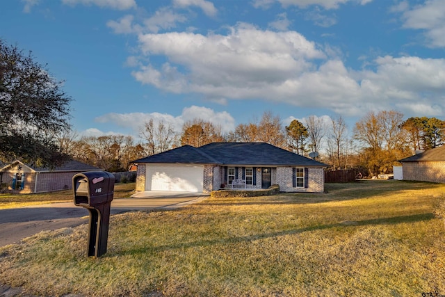 ranch-style home with a front lawn and a garage