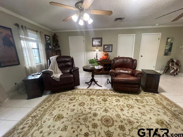 tiled living room with crown molding, ceiling fan, and a textured ceiling