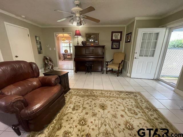 living room featuring ceiling fan, a healthy amount of sunlight, and light tile patterned flooring