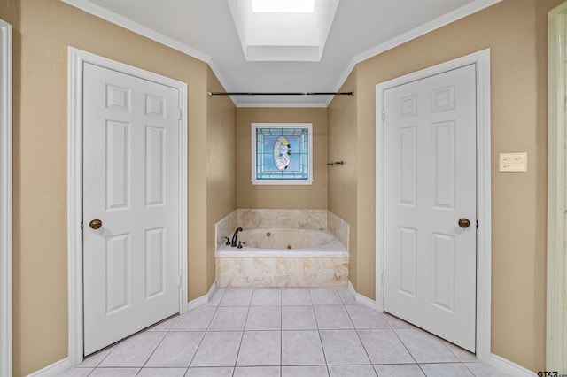 full bathroom featuring crown molding, tile patterned floors, a tub with jets, and a skylight