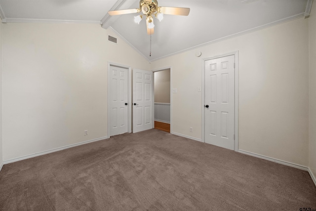 unfurnished bedroom featuring lofted ceiling with beams, ornamental molding, visible vents, carpet flooring, and baseboards