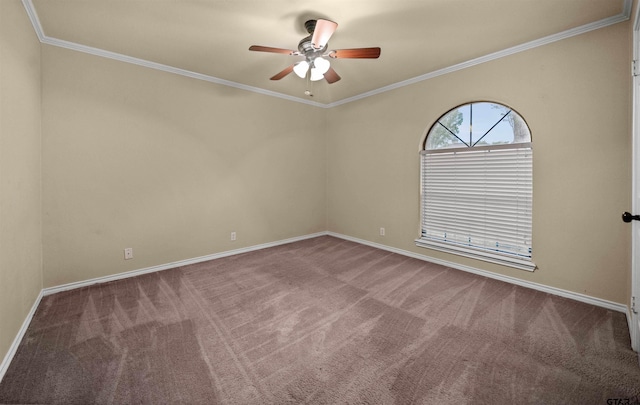 spare room featuring ornamental molding, ceiling fan, baseboards, and carpet flooring