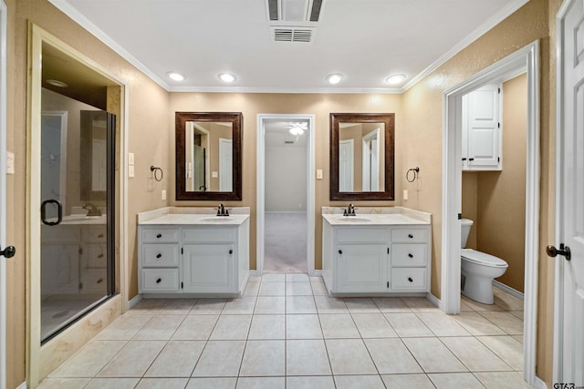 bathroom featuring ornamental molding, a sink, tile patterned flooring, and visible vents