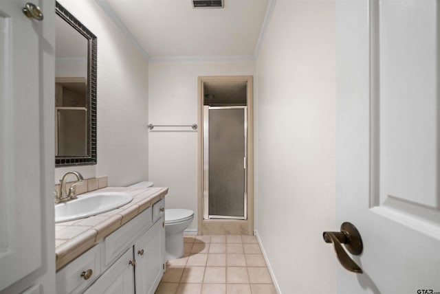 bathroom featuring vanity, ornamental molding, tile patterned flooring, toilet, and a shower stall