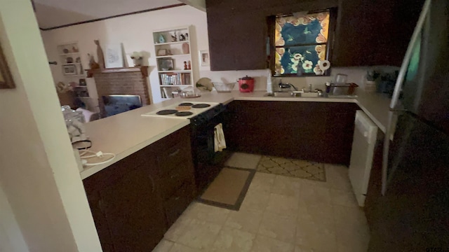 kitchen featuring dark brown cabinets, kitchen peninsula, sink, and white appliances