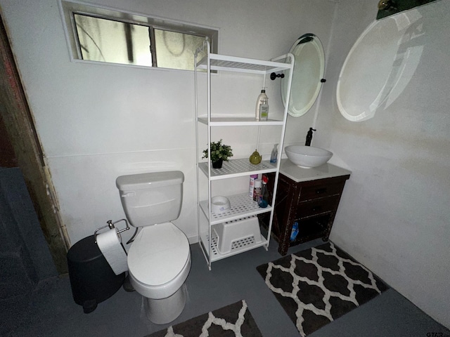 bathroom featuring toilet and vanity