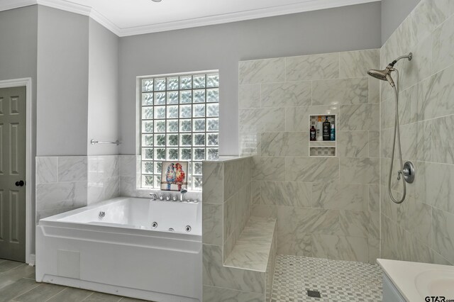 bathroom featuring a whirlpool tub, crown molding, tiled shower, and tile patterned floors
