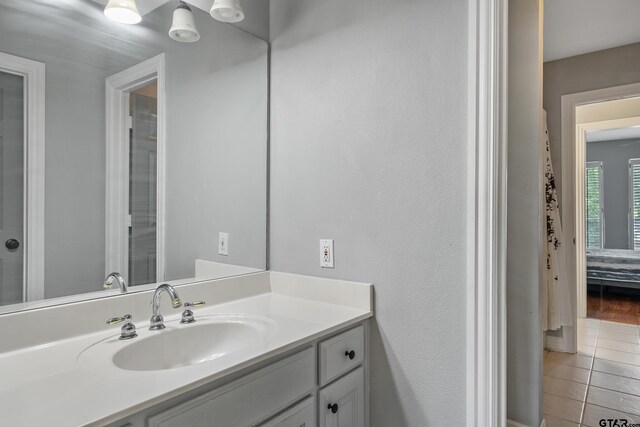 bathroom with vanity and tile patterned flooring