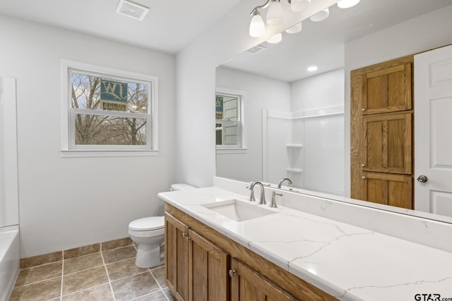 bathroom with toilet, vanity, visible vents, and tile patterned floors