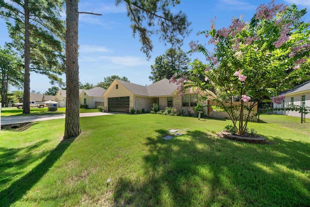 ranch-style home featuring a garage and a front lawn