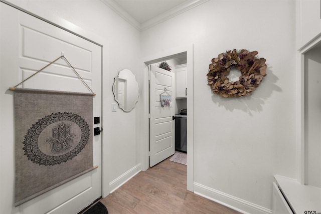 corridor featuring light wood-type flooring and crown molding