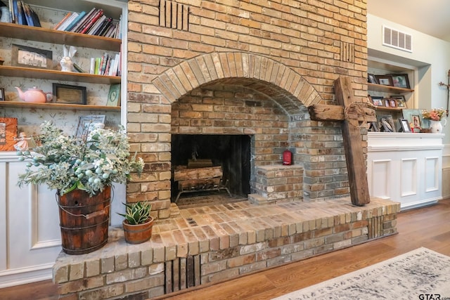 living room featuring hardwood / wood-style flooring and a fireplace