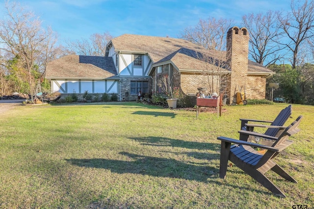 rear view of house with a lawn