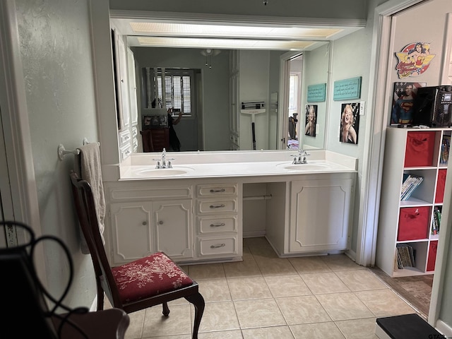 bathroom with tile patterned flooring and vanity