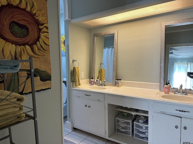 bathroom featuring tile patterned flooring and vanity