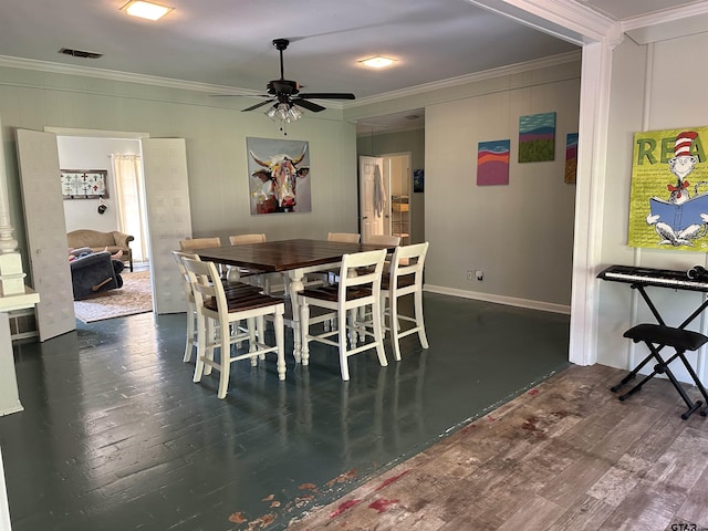 dining space with ceiling fan, ornamental molding, and dark hardwood / wood-style floors