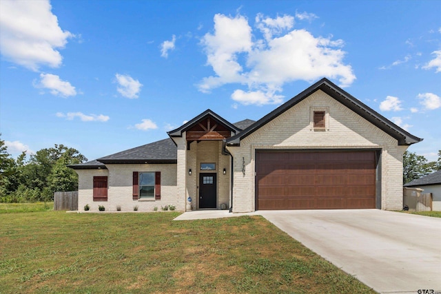 view of front facade with a garage and a front yard